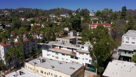 Aerial-reverse-pullback-shot-of-Hollywood-Hills-apartments-in-Los-Angeles,-California