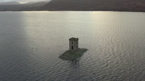 Eilean-Nam-Faoilaig-crannog-on-Loch-Rannoch-in-Perthshire,-Scotland