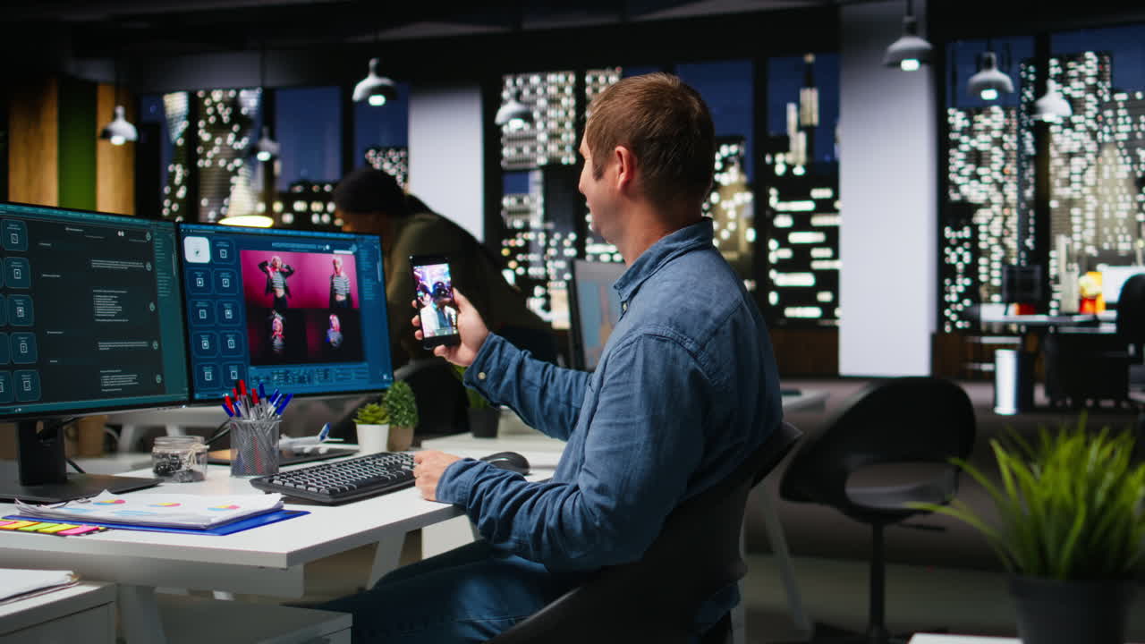 Male photo editor retouching images and scrolling on social media