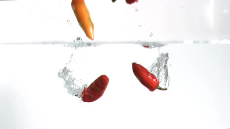 Chilies-falling-into-water-in-super-slow-motion