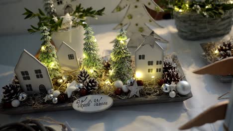 christmas decoration of trees and houses with lights and merry christmas wishes