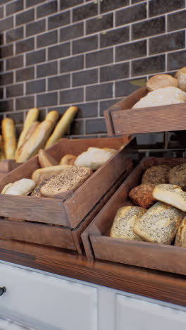 assortment of freshly baked bread in wooden crates