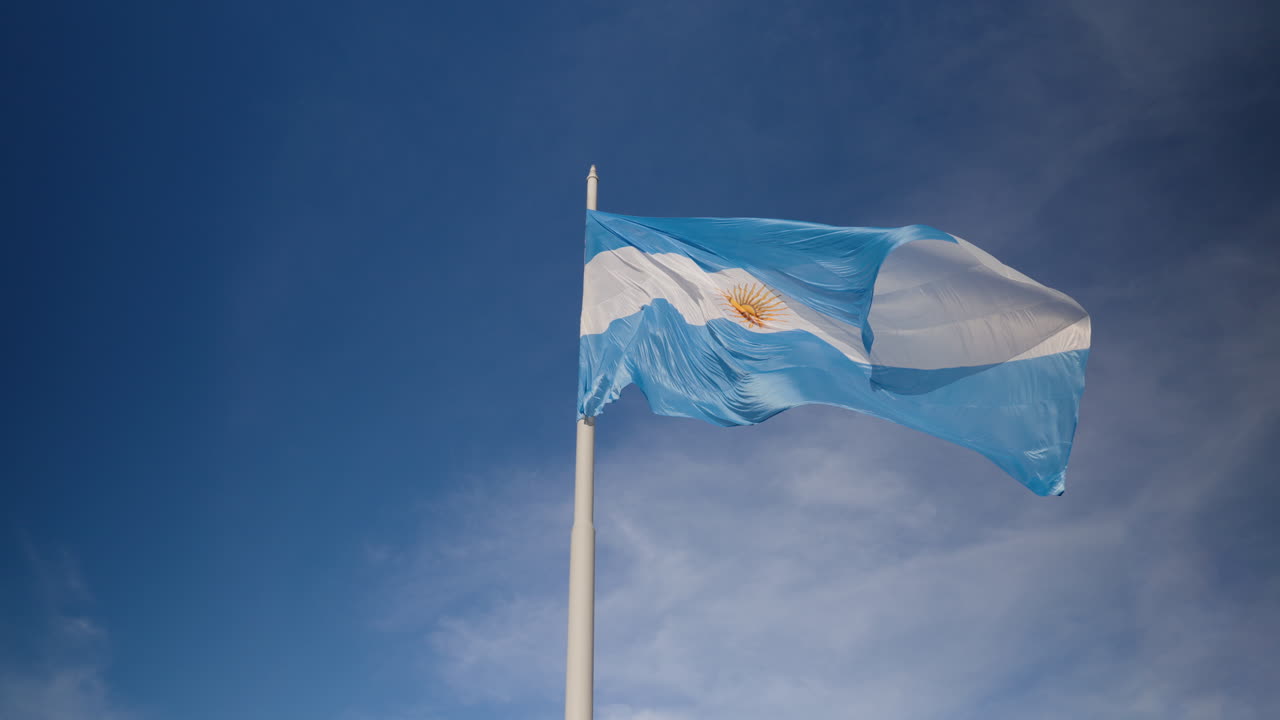 A slowly waving Argentine flag, located in Plaza de Mayo , Argentina's Presidential Palace