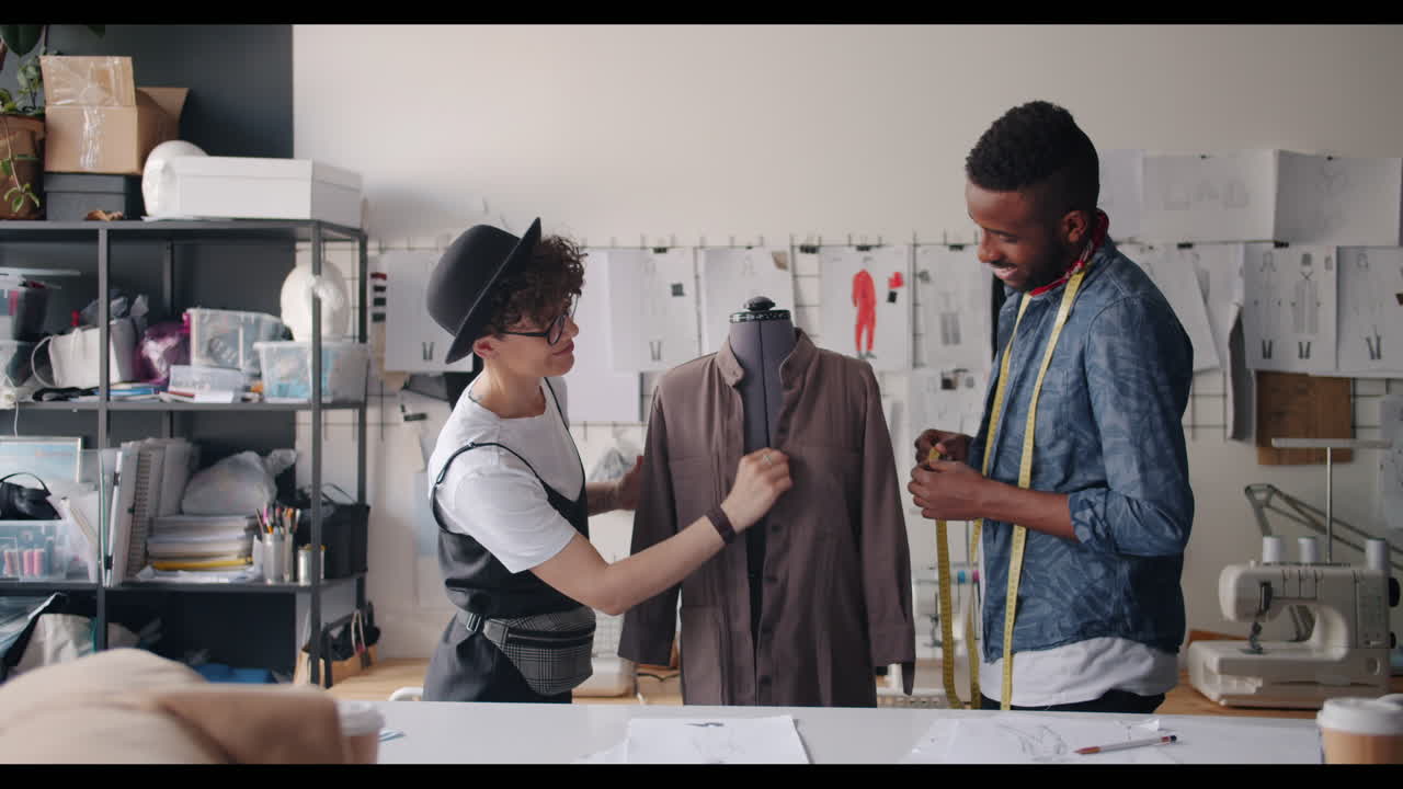 Fashion Designers Measuring and Fitting a Garment