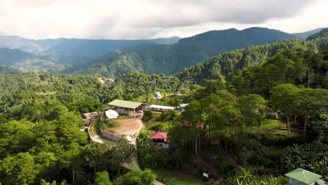 Aerial-footage-of-village-inSagada,-Mountain-Province,-Philippines-with-Cordillera-mountains-in-the-background-using-DJI-Mini-2