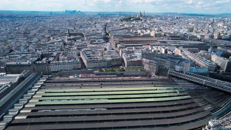 Aerial-View-Over-Paris-Gare-Du-Nord-Train-Station-With-Pan-Right-Cityscape-Reveal