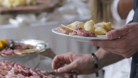 wedding appetizer with salami and fried