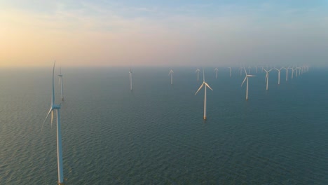 huge windmill turbines, offshore windmill farm in the ocean westermeerwind park , windmills isolated at sea on a beautiful bright day netherlands flevoland noordoostpolder