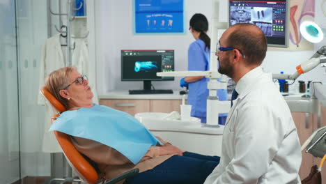 Old-woman-having-medical-treatment-at-dentist-office