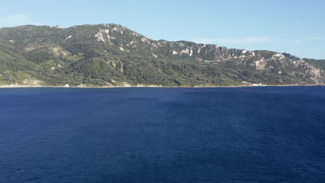 aerial shot flying back in a mediterranean coastline