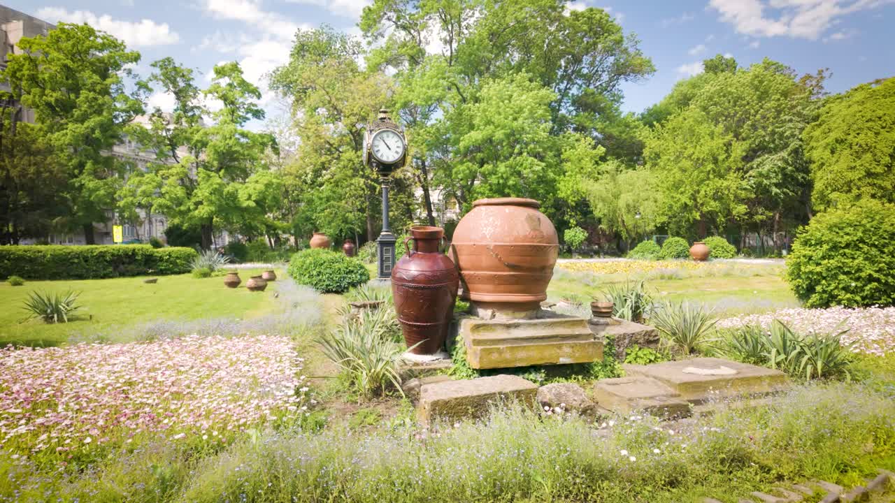 Park entrance with clay pots and flowers in Cișmigiu