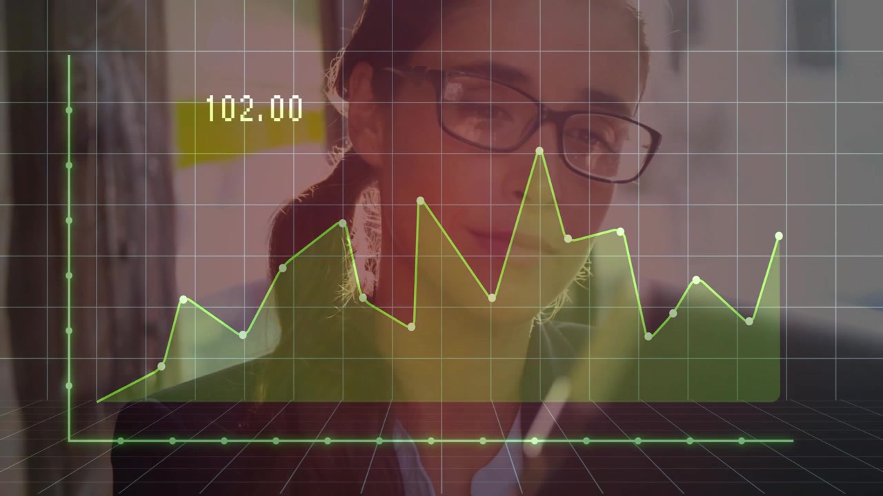 Businesswoman Analyzing Financial Data on Tablet with Digital Graph Overlay