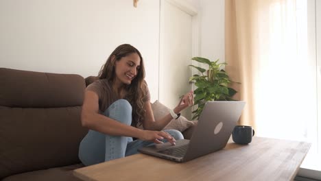 happy woman making online purchases with credit card at home
