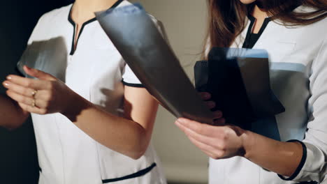 radiology department. female doctors examining x-ray in the medical office