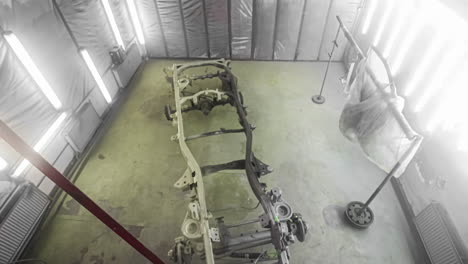 priming and painting an auto body frame in an auto body paint booth - time lapse