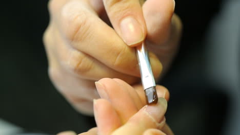 nail care and manicure. woman hands in a nail salon receiving a manicure
