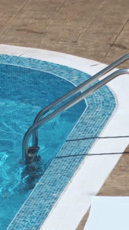 woman swimming on a blue water pool
