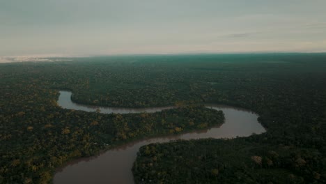 river snakes through vast tropical rainforest landscape