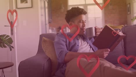 animación de iconos de corazón sobre el hombre caucásico leyendo