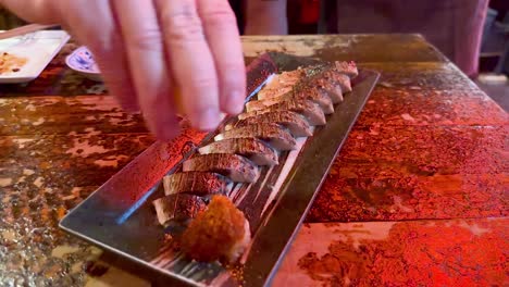 chef prepares sushi with dramatic flair