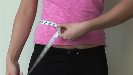 woman measuring herself