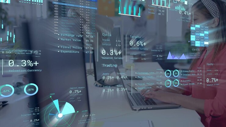 Woman at right typing on laptop and updating business analytics HUD while monitoring pie charts