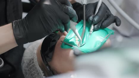 dentist examining a patient's teeth in the dentist.