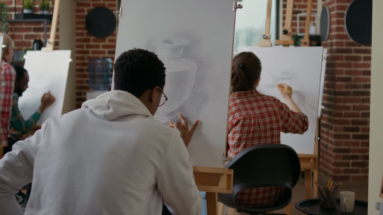 Creative student taking picture of vase sketch on smartphone