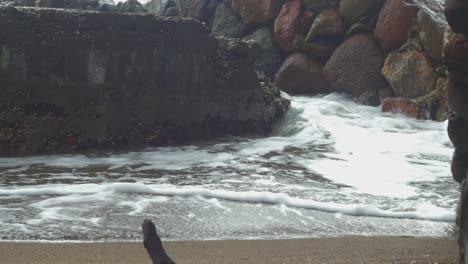waves hitting the concrete ruins in stormy weather