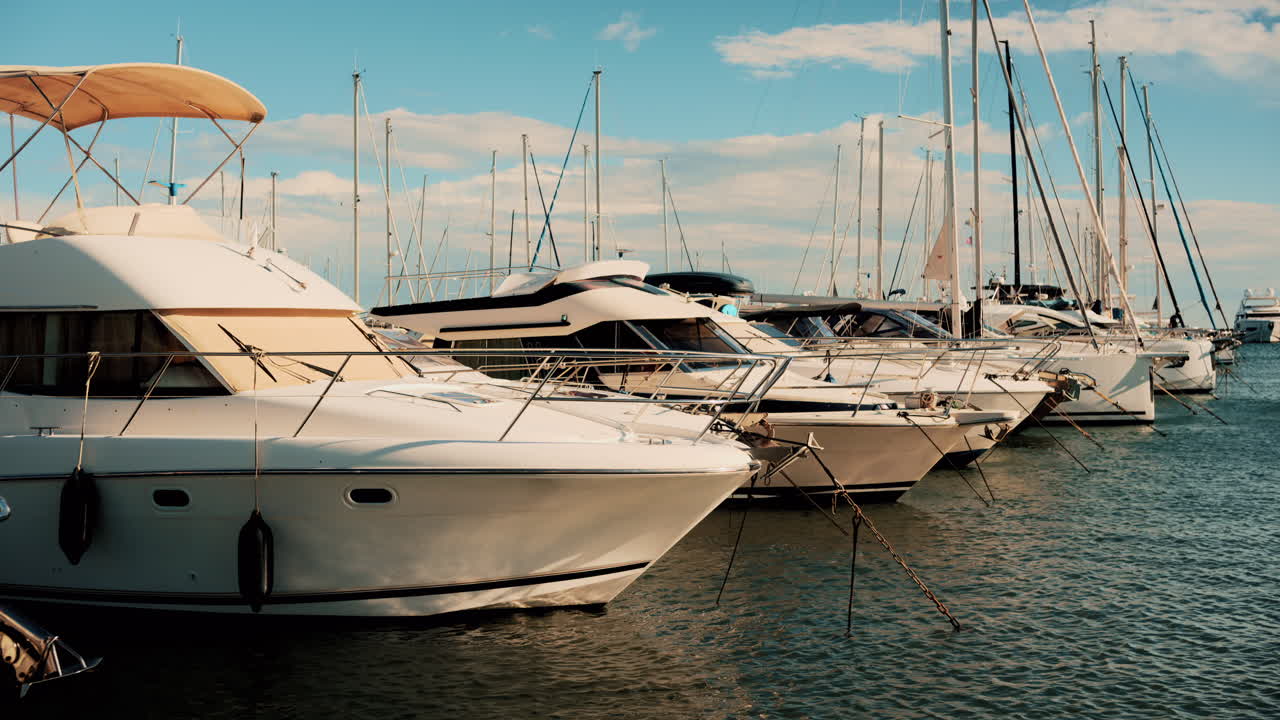 Cannes, France - October 13, 2025: White yachts and sailboats moored in a calm marina