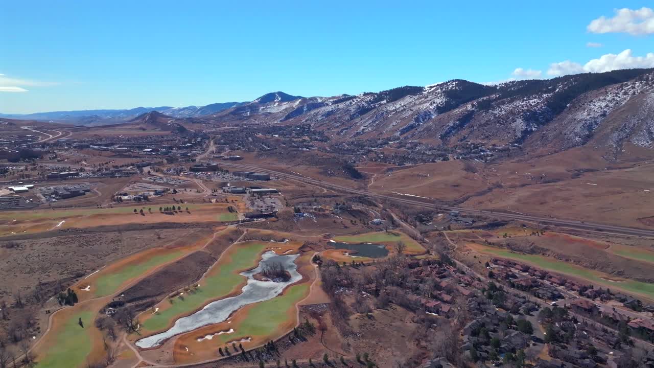 Lookout Mountain with snow Morrison Golden aerial drone Colorado School of Mines Fossil Trace Golf Club Jefferson County historic downtown winter sunny morning afternoon blue sky homes forward motion