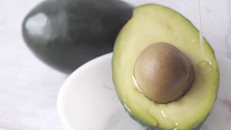 close-up of a cut avocado in a bowl