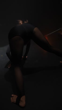 contemporary dance performance in dark studio
