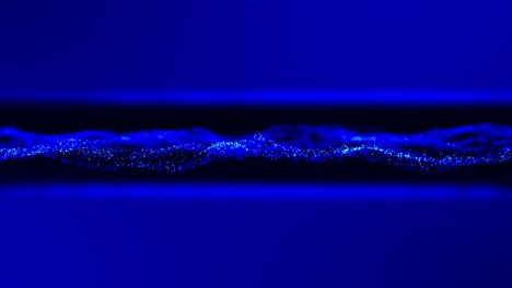 blue waving energy particles as abstract technology design blurred background. uhd 4k seamless video loop animation.