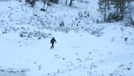 man hiking in snowy