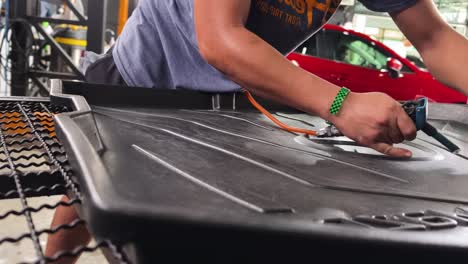 cleaning a car floor mat