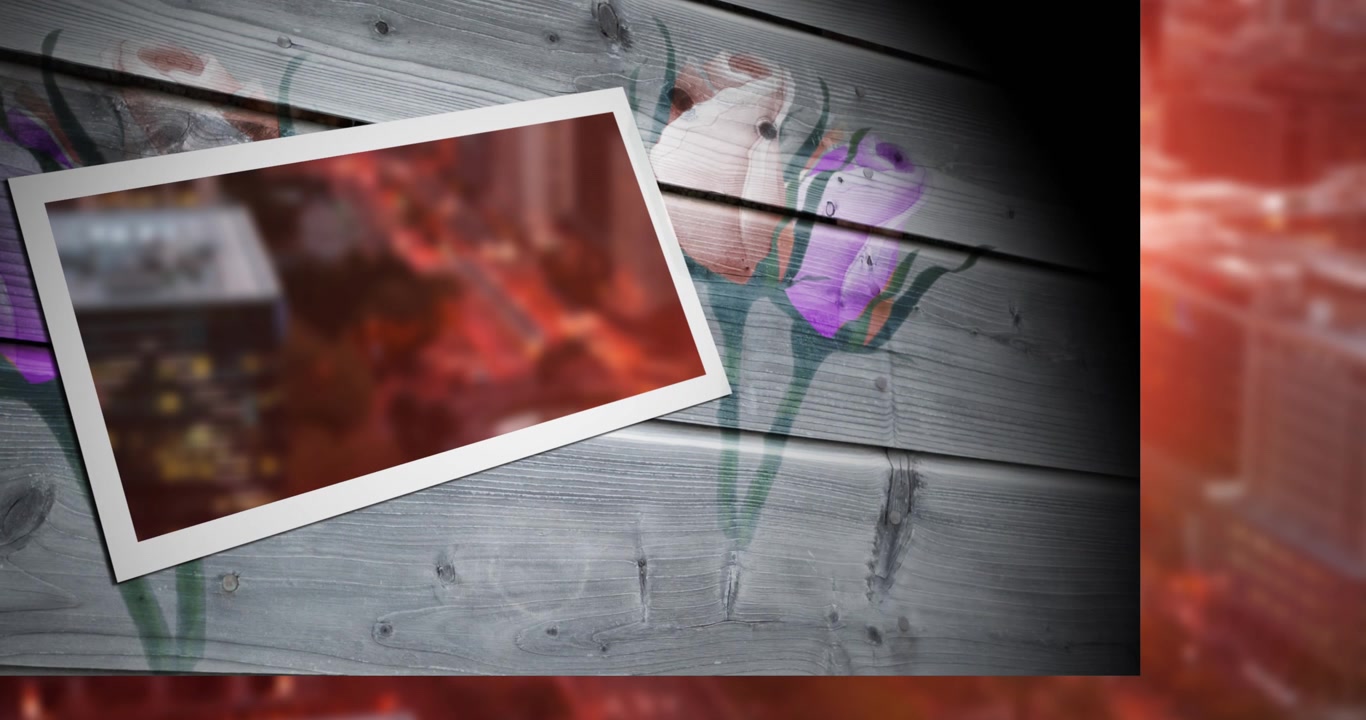 Animación de un paisaje urbano borroso en un marco de fotos sobre un diseño floral en un tablón de madera.