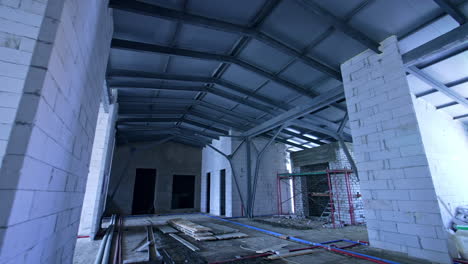 new bulkheads of white bricks built to support the roof of. attic floor of the building under reconstruction.