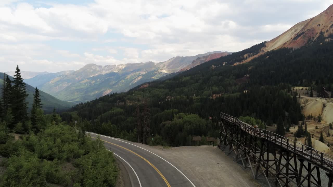 Drone Flight along the trestle at the entrance of the Idarado Mine, part of the Red Mountain Mining District in between Ouray and Silverton Colorado on the Million Dollar Highway HWY 550