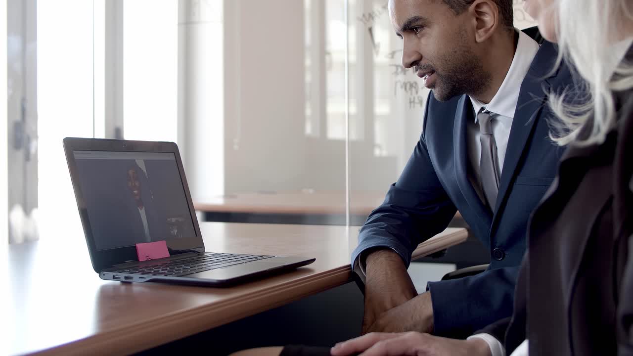 Business colleagues talking via video call