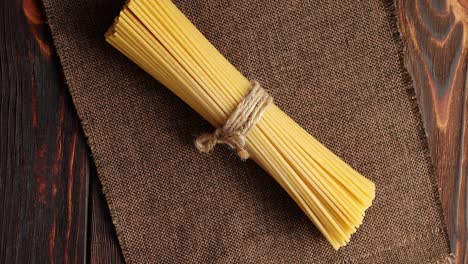 Bunch-of-spaghetti-on-burlap-textile