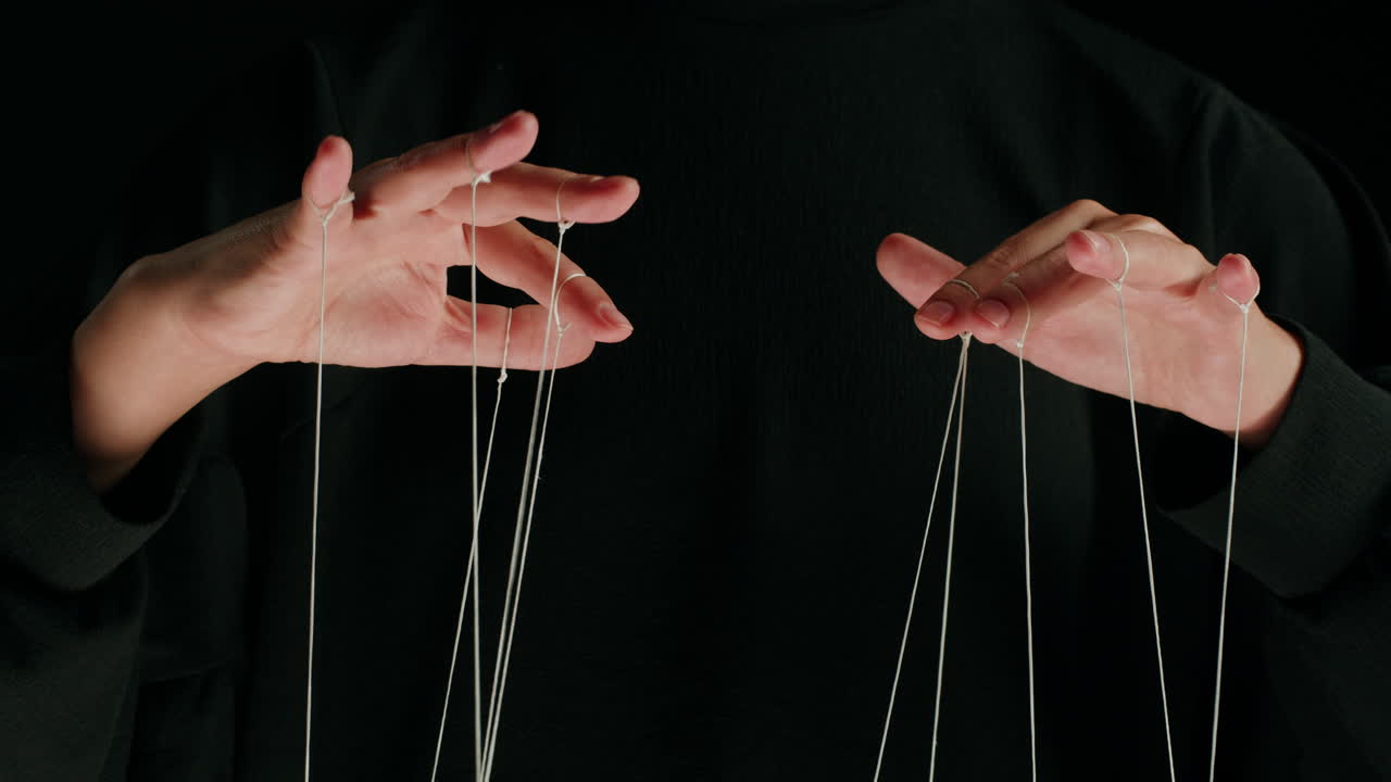 Human Hands Manipulating Strings in a Metaphor for Control