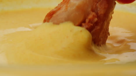 crispy fried chicken in creamy yellow dip