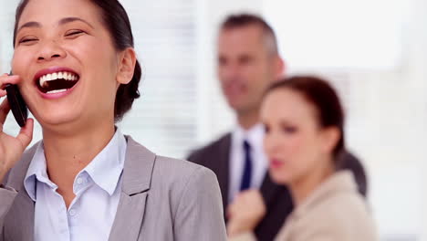 happy businesswoman having a phone conversation