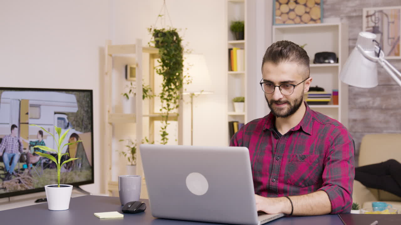 A man working from home on a laptop