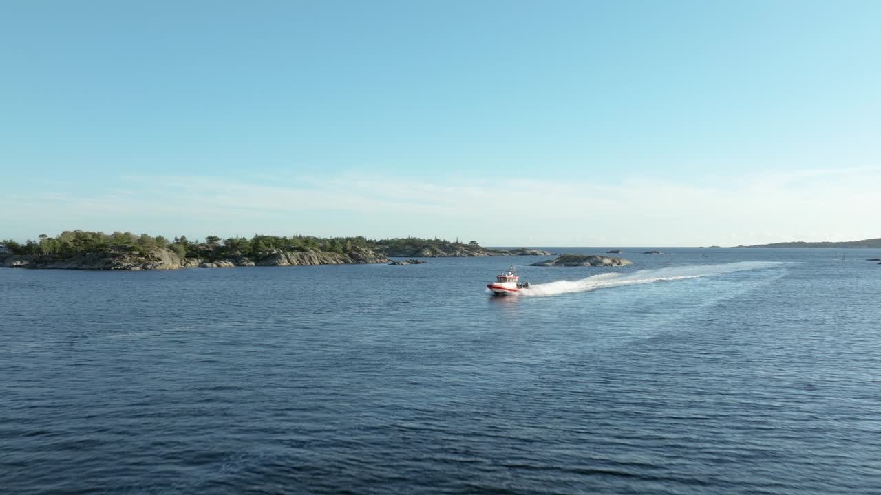 A picturesque coastal village nestled among rugged rocks, featuring charming houses and calm water. The scene captures the serene beauty of nature on a clear day, inviting exploration