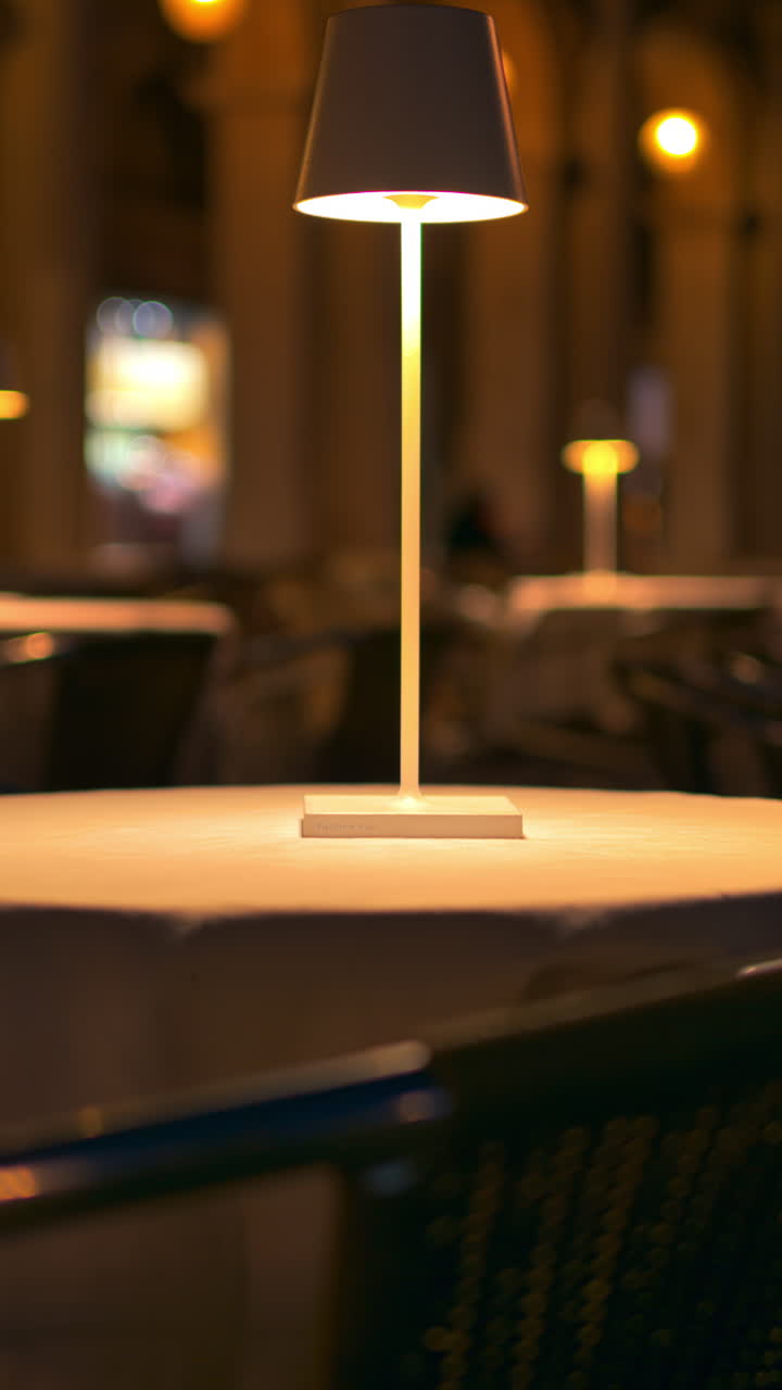 Close up of a lamp on a table in the St. Mark Square in the evening, in Venice, Italy. Vertical, Venice, Italy
