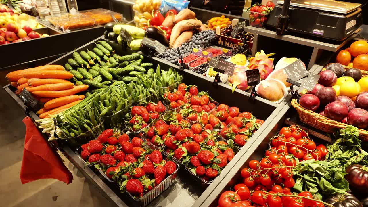 Vibrant fruits and vegetables at local summer market in Latvia under warm light