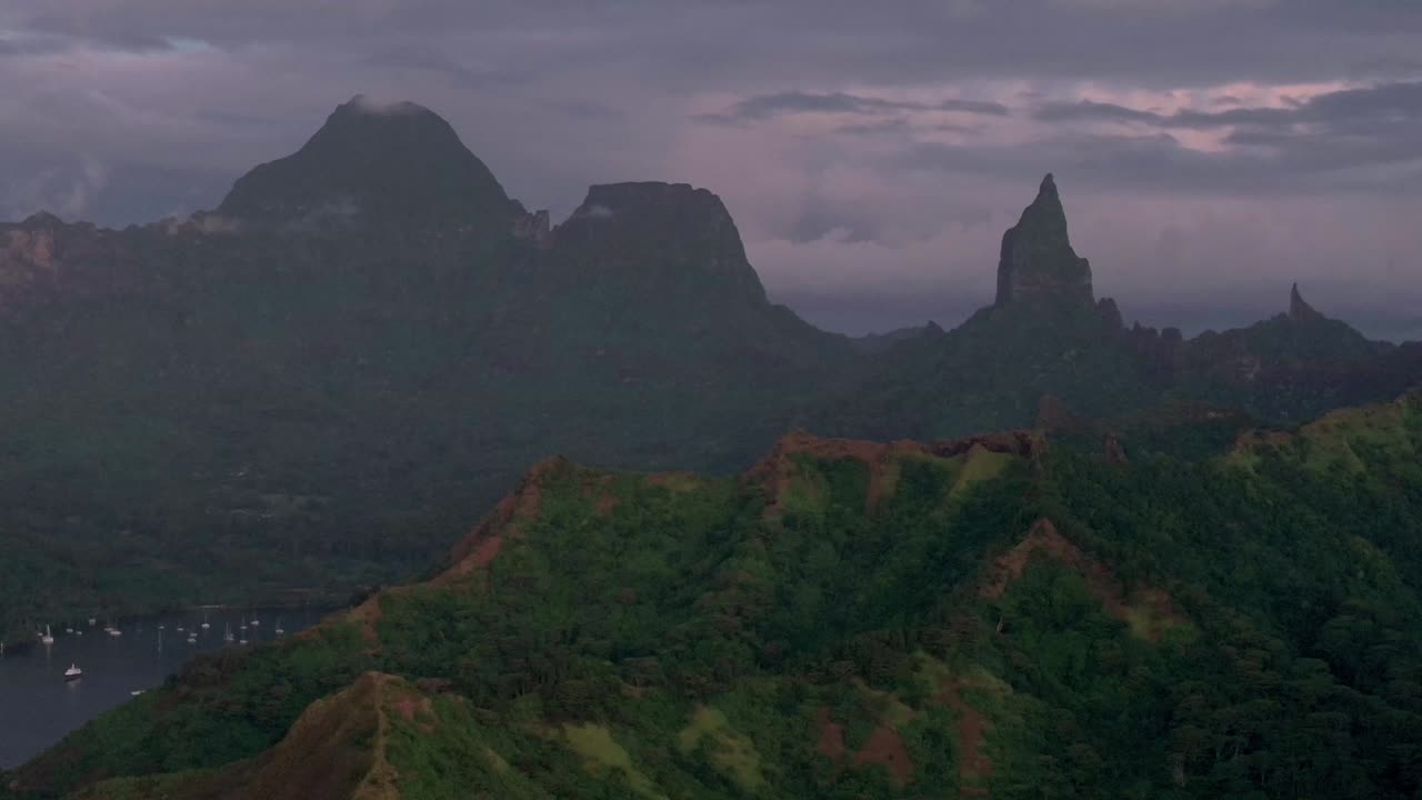 Breathtaking Aerial View of Lush Mountains and Calm Ocean