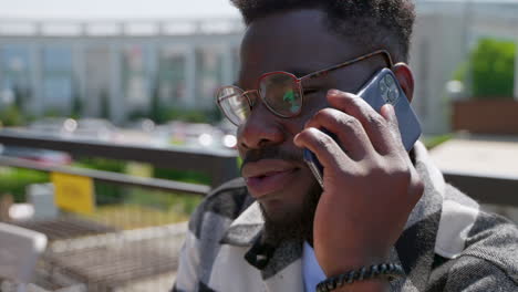 man talking on phone outdoors